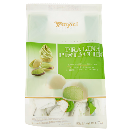 A package of Vergani Pralina Pistacchio (chocolate-covered pistachio ice cream dumplings) on a clean white background. The packaging is white and light green, featuring a photo of a green pistachio ice cream dumpling and a chocolate-covered dumpling with a green pistachio filling.